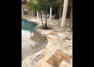 Travertine Pool Deck with a tree
