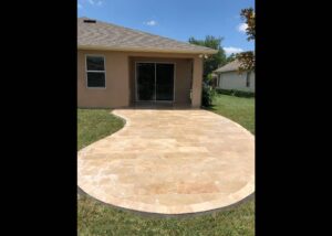 Close up Travertine Patio and a house