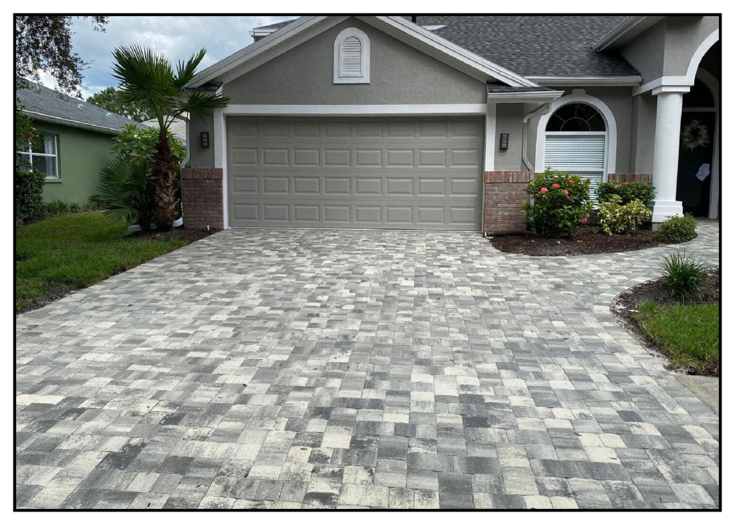Long view of the grey color stones in front of the house