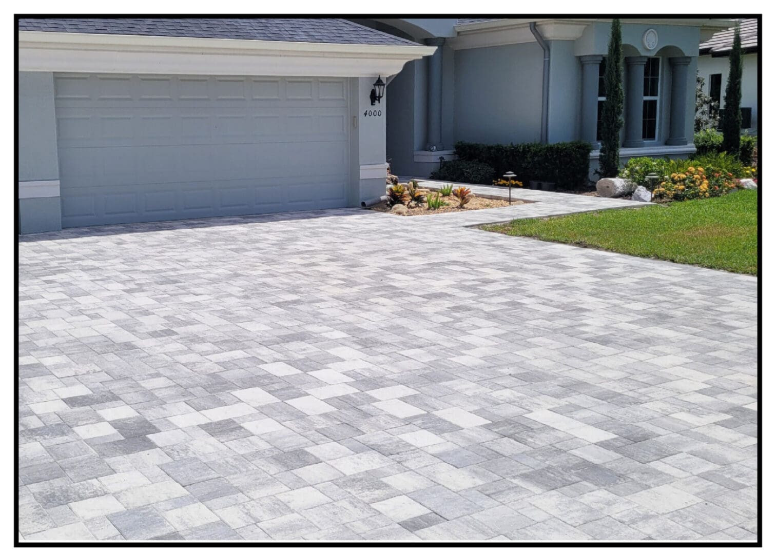 Long view of the grey color stones in front of the house