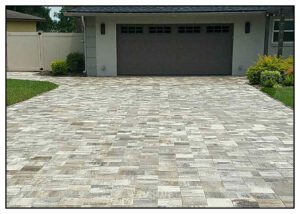 A driveway with a garage door.